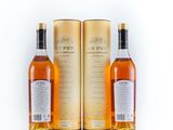 three bottles of whisky on a white background