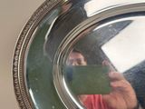 a woman taking a picture of herself in a mirror
