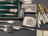 silverware and silverware on display on a table
