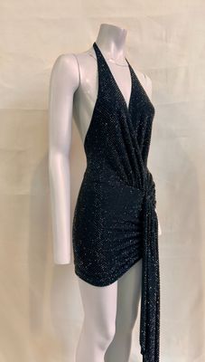a mannequin wearing a black dress with a tie around the waist