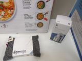 a box of food sitting on a table next to a package of food