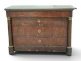 a small chest of drawers with a marble top