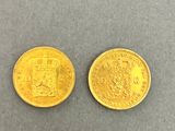 two gold coins, one of which is a sovereign and one of which is a sovereign