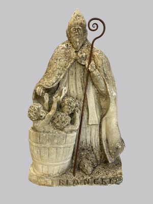 an image of a statue of a man with a dog and a basket