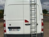a white van with a ladder attached to the back of it