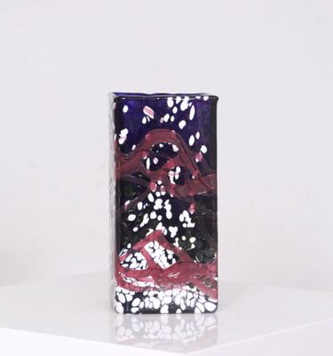 MILANE à BIOT. Vase en verre teinté bleu à décor moucheté bl…