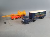a toy truck with a crane on the back of it