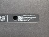 the back of a laptop computer with a qr code on it