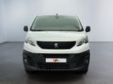 the front view of a white van parked in a white room