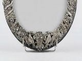 a picture of a silver plate with birds on it