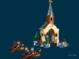 a lego hogwart ' s castle with a boat and people in it