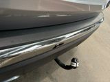 a close up of a car ' s bumper with a key attached to it