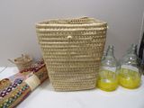 a basket that is sitting on a table next to some bottles