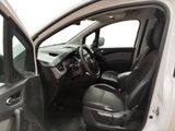 the interior of a car with the door open and the driver ' s seat down