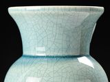 a blue vase that has a cracky surface on it