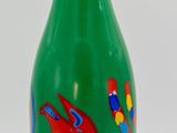 green glass bottle with red and blue dragon design on it