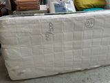 a mattress that is sitting on the floor in a room