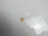 a white bowl with a brown design on it