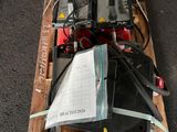 a wooden pallet with a bunch of electronics on top of it