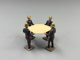 figurines of two men in uniform sitting at a table
