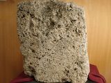 a large rock sitting on top of a chair in a room