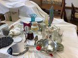 a table that has a lot of dishes and utensils on it