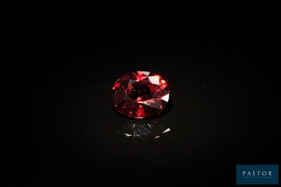 a red diamond on a black surface