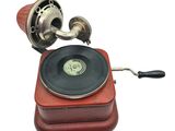 an old record player sitting on top of a wooden box