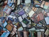 many different types of cards scattered together on a table