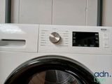 an image of a washing machine with the door open
