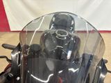a close up of a motorcycle with a clear windshield