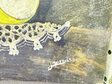 a picture of a painting of a cater on a piece of wood