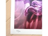 a picture of a picture of a purple flower on a wooden table