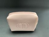 a small pink purse sitting on top of a table