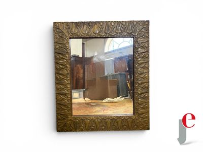 a picture of a mirror hanging on the wall of a room