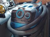 an image of a vacuum with a hose attached to it
