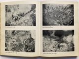 an open book with black and white photos of a city in the middle of the pages