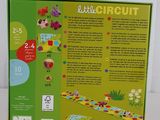 an image of a little circuit game in a box on a table
