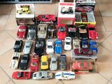 a lot of toy cars that are sitting on the floor