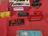 a red table with a bunch of toy cars on it