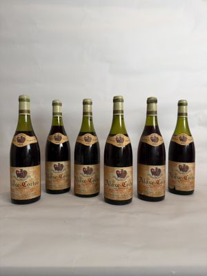 six bottles of wine lined up in a row on a table