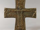 an old bronze cross with a jesus on it