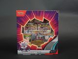 une photo d'une boîte de cartes Pokémon posée sur une table