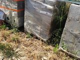 a pile of concrete blocks sitting on the side of the road