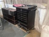 a black tool cabinet and a black tool cart in a room