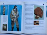an open book with a picture of a man wearing a gas mask
