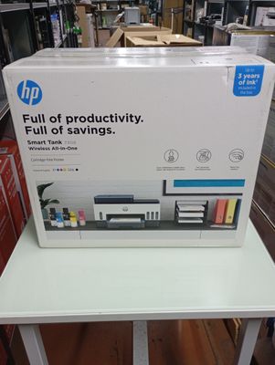 a box of hp products sitting on a table in a store