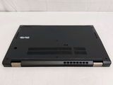 the back of a black laptop computer sitting on top of a white surface
