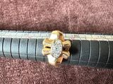 a pen with a diamond on it sitting on a brown surface