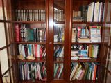 many books on the shelves in the room